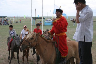 Master of ceremonies throat singing in praise of the horses