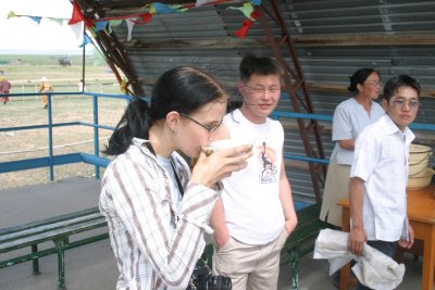 Christina tries the araik (fermented mare's milk)