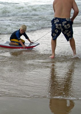 Dad and son boogie boarders