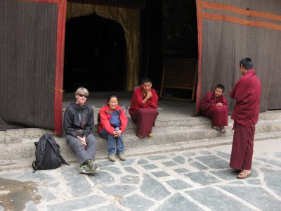 Philip hangs out with the Monks at the Sakya Monastery who were fascinated with his arm hair and smartphone