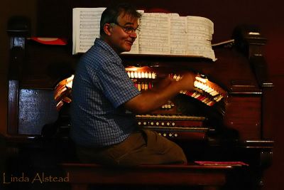 There's that man again...playing that Wurlitzer