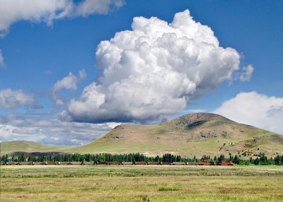 Afternoon buildups behind the coal empty near Dixon, MT