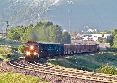 BNSF 1044 leading a very backlit LAUPAS out of Missoula, MT. (6/9/12)