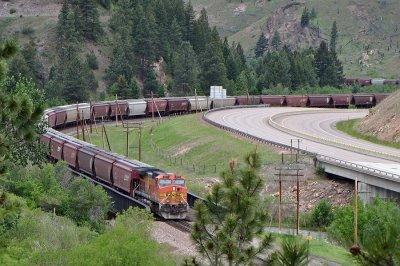 Away shot of the train and DP snaking into the next canyon west of Bearmouth.