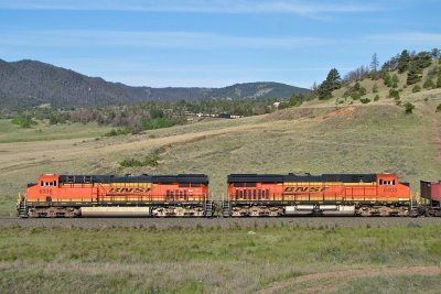 Rear DPUs BNSF 6338 & 6403 now passing with the mid-trains at Weed.