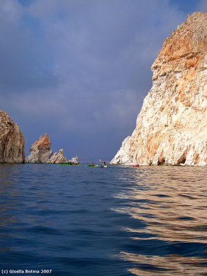 dark clouds and sunshine, it makes the rocks look very colourful