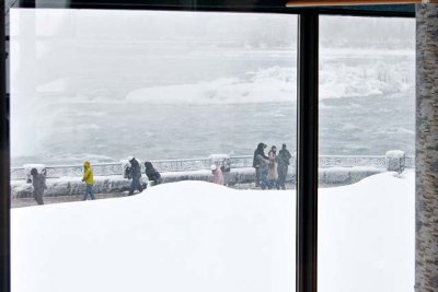 The Canadian Falls, seen through the window of the Elements on the Falls Restaurant