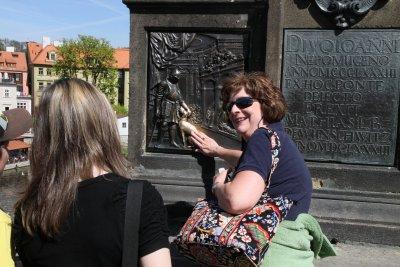 Jane touching the good luck plaque-It means she will return to Prague!