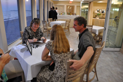 Sue does caricatures for guests
