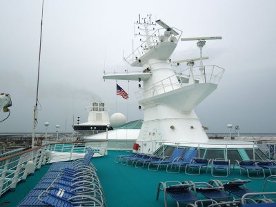 The ship's mast towers above the Compass Deck