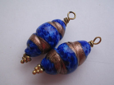 blue and gold beads becoming earrings