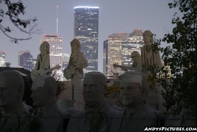 Giant Beatles statues in Houston at night