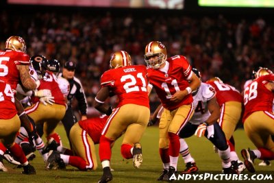 San Francisco 49ers QB Alex Smith hands off to RB Frank Gore