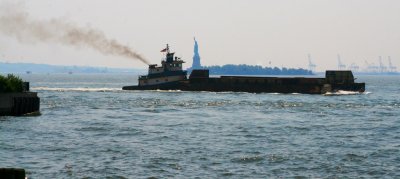 Boat in front of Statue of Liberty