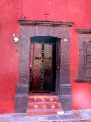 red walls, glass cross door