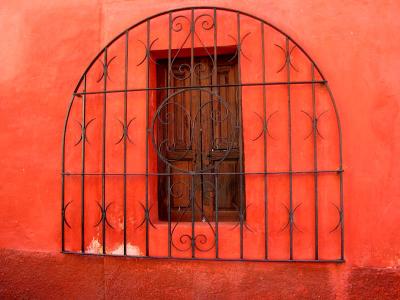 red window, iron gate