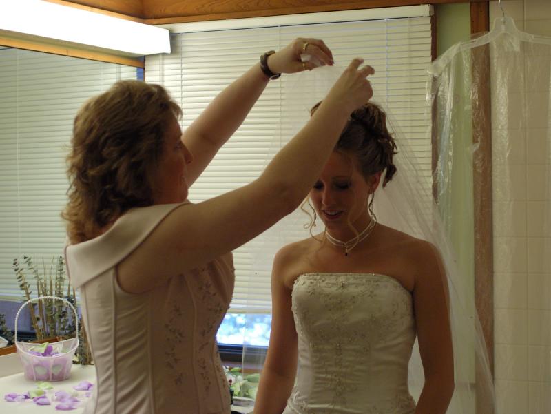 The bride being veiled