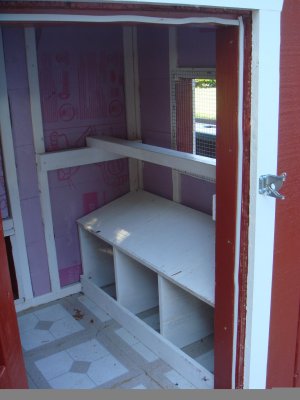 Insulated interior with nesting boxes and perch.