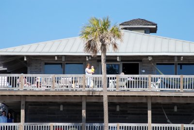 Enjoying the top balcony and watching the kids below on the beach