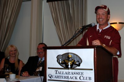 Coach Fisher at the podium