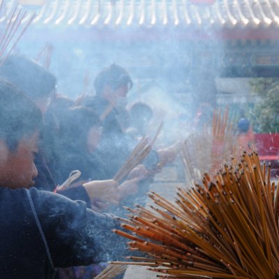a huge bundle of glowing incense sticks