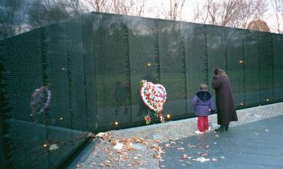My daughter and granddaughter finding the name of CPL Richard Rudd that saved their dad/grandad in Vietnam. It was freezing today. By the evening, it was down to 11 degrees and windy. BRRRRR!