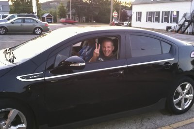 Scotty boy in his new Chevy Volt.JPG