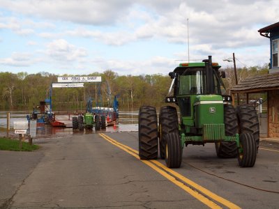 A second tractor holds the ferry in place