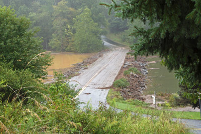 Road across Black Hill lake after flooding