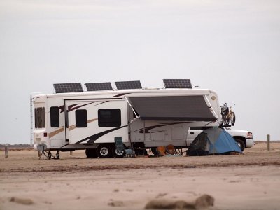 RV with solar panels and DIRECTV