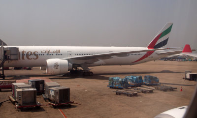 Emirates 777-300ER at gate at MAA