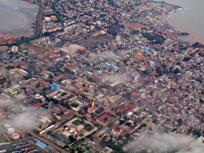 Conakry unfolds below us