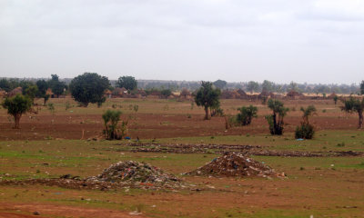 Trash piles outside villages