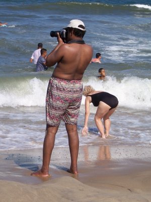 Photographer in swimming trunks