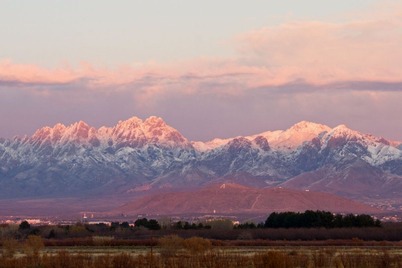 Sunset #1 on snow covered Organ Mountains, NM