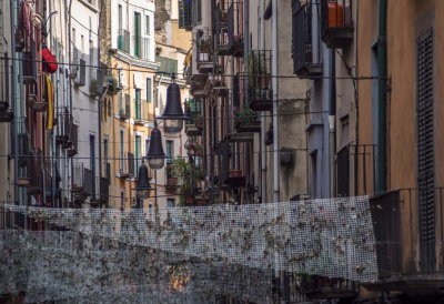 Main avenue in historic Girona -- the netting holds the remains of a recent flower festival