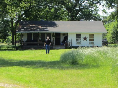 John Taylor crosses yard at former Love family farm in Chicota