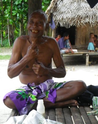 The Kaibola village chief preparing his after lunch betelnut