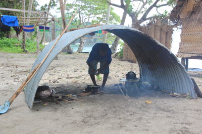 Kaibola Kitchen. The chiefs son preparing a delicious lunch of fresh lobster and pancakes.