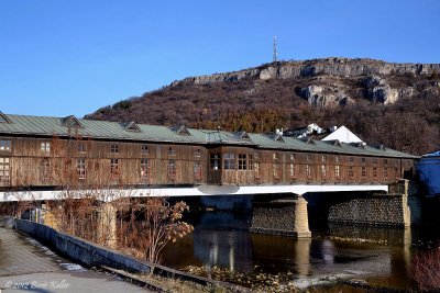 The Covered Bridge crosses the Ossam River