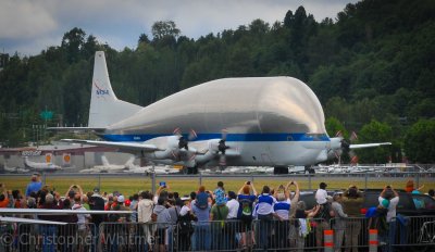 An excited crowd welcomes the Super Guppy