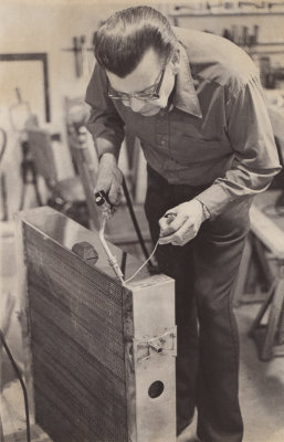 Ed Kay (Maurice Edward Kay) working on airplane radiator