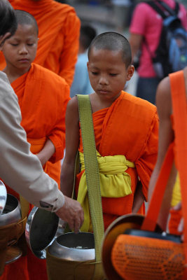 Monk receiving an offer