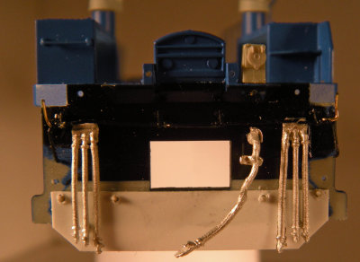 Notches cut on the pilot for the uncoupling lever, added uncoupler lever extensions made of .012 brass wire.