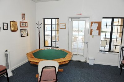 NEXT TO THE MAILROOM IS THE GAME ROOM WHICH OVERLOOKS THE POOL