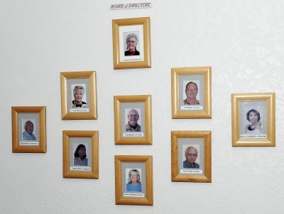 ON THE WALL OF THE GAME ROOM ARE PICTURES OF THE BOARD OF DIRECTORS OF THE RESORT