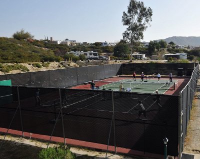 THERE ARE OFTEN SEVERAL GAMES OF PICKLE BALL GOING ON AT ONE TIME AT THE COURTS