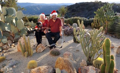 SARA AND DON TOOK THEIR CHRISTMAS CARD PHOTO WITH CHARLIE IN THE CATCUS GARDEN