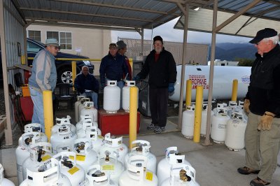 TWO MORNINGS A WEEK VOLUNTEERS GET UP BEFORE LIGHT TO FILL PROPANE TANKS FOR RESORT MEMBERS