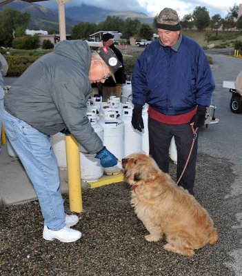 IF YOU ARE WALKING YOUR DOG WHEN THE PROPANE CREW IS WORKING YOU ARE MOST APT TO GET A COOKIE-ONLY THE DOG GETS A COOKIE